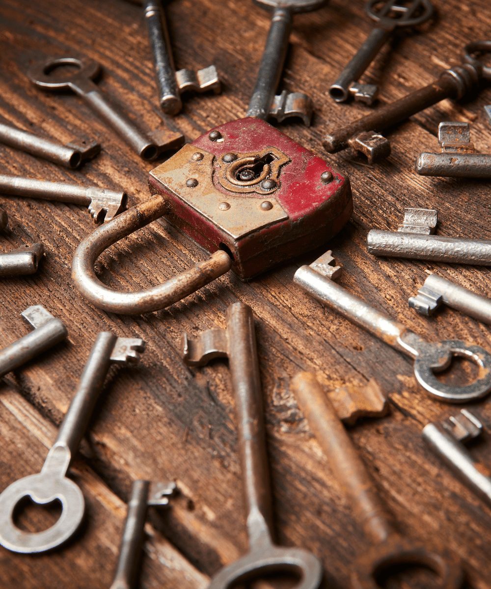 Many keys surrounding a lock